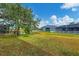 Large backyard with pond view and lush grass at 4360 85Th Avenue E Cir, Parrish, FL 34219