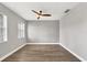 Spacious bedroom with hardwood floors and ceiling fan at 4360 85Th Avenue E Cir, Parrish, FL 34219