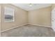 Well-lit bedroom with window and neutral carpet at 4360 85Th Avenue E Cir, Parrish, FL 34219