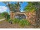 Brick community sign for Creekside, featuring landscaping and palm trees at 4360 85Th Avenue E Cir, Parrish, FL 34219