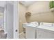 Laundry room with washer, dryer, and shelving at 4360 85Th Avenue E Cir, Parrish, FL 34219