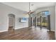 Living room with high ceilings, large windows, and wood-look floors at 4360 85Th Avenue E Cir, Parrish, FL 34219