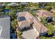 Luxury home with tile roof, pool, and a golf course view at 45 Grand Palms Blvd, Englewood, FL 34223