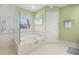 Elegant bathroom with soaking tub and separate shower at 45 Grand Palms Blvd, Englewood, FL 34223