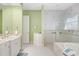 Spa-like bathroom with walk-in shower and built-in seating at 45 Grand Palms Blvd, Englewood, FL 34223