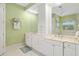 Bathroom with double vanity and extensive storage at 45 Grand Palms Blvd, Englewood, FL 34223