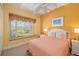 Comfortable bedroom with window seat and ample natural light at 45 Grand Palms Blvd, Englewood, FL 34223