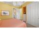 Bright bedroom with double beds, ensuite bathroom access, and ample closet space at 45 Grand Palms Blvd, Englewood, FL 34223