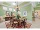 Bright dining room features a glass-top table and chandelier at 45 Grand Palms Blvd, Englewood, FL 34223