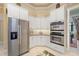 Stainless steel appliances and white cabinetry at 45 Grand Palms Blvd, Englewood, FL 34223