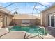 Relaxing pool and spa area with covered patio at 45 Grand Palms Blvd, Englewood, FL 34223