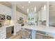 Modern kitchen boasts white cabinets, stainless steel appliances, and quartz countertops at 4512 Renwick Dr, Parrish, FL 34219