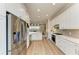 Modern kitchen with stainless steel appliances and white cabinets at 4512 Renwick Dr, Parrish, FL 34219