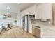 Stainless steel appliances and white shaker cabinets highlight this kitchen at 4512 Renwick Dr, Parrish, FL 34219