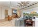 Living room with light walls, hardwood floor and comfortable seating at 4512 Renwick Dr, Parrish, FL 34219