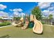 Community playground with slides and climbing structures at 4512 Renwick Dr, Parrish, FL 34219