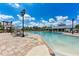 Community pool with a shallow end and water slide at 4512 Renwick Dr, Parrish, FL 34219