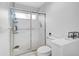 Clean bathroom with a shower and toilet at 4728 Sand Trap Street E Cir, Bradenton, FL 34203