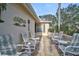 Relaxing patio area with comfortable seating and a view of the golf course at 4728 Sand Trap Street E Cir, Bradenton, FL 34203