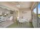 Relaxing sunroom with access to the living room at 4728 Sand Trap Street E Cir, Bradenton, FL 34203