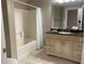 Bathroom with tub, vanity, and granite countertop at 4751 Travini Cir # 4-108, Sarasota, FL 34235