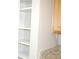 White kitchen shelves offering ample storage space at 4751 Travini Cir # 4-108, Sarasota, FL 34235