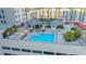 Rooftop pool and patio area with surrounding building and landscape at 50 Central Ave # 17Phc, Sarasota, FL 34236