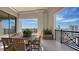 Spacious balcony with dining table, chairs, and city views at 50 Central Ave # 17Phc, Sarasota, FL 34236