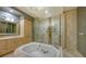 Spa-like bathroom featuring a soaking tub and walk-in shower at 50 Central Ave # 17Phc, Sarasota, FL 34236