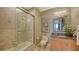 Clean bathroom with a shower/tub combo and granite vanity at 50 Central Ave # 17Phc, Sarasota, FL 34236