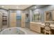 Upscale bathroom with a free-standing tub and separate shower at 50 Central Ave # 17Phc, Sarasota, FL 34236