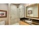 Bathroom with a walk-in shower and granite countertop at 50 Central Ave # 17Phc, Sarasota, FL 34236