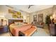 Spacious bedroom with king bed, sitting area, and artwork at 50 Central Ave # 17Phc, Sarasota, FL 34236