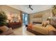 Comfortable bedroom with a king-size bed, dresser, and access to a private balcony at 50 Central Ave # 17Phc, Sarasota, FL 34236