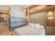 Spacious bedroom with large windows and an accent wall at 50 Central Ave # 17Phc, Sarasota, FL 34236