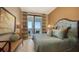 Guest bedroom with balcony access and city views at 50 Central Ave # 17Phc, Sarasota, FL 34236