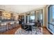 Elegant dining area with modern table and bar with city views at 50 Central Ave # 17Phc, Sarasota, FL 34236