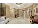 Bright and spacious entryway with large mirrors and modern furniture at 50 Central Ave # 17Phc, Sarasota, FL 34236