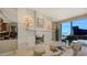 Modern fireplace with a sleek design and artistic wall sconces at 50 Central Ave # 17Phc, Sarasota, FL 34236