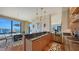 Modern kitchen with marble countertops and a large island at 50 Central Ave # 17Phc, Sarasota, FL 34236