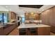 Modern kitchen with marble island and custom wood cabinetry at 50 Central Ave # 17Phc, Sarasota, FL 34236