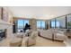 Open living space with large windows offering panoramic city views at 50 Central Ave # 17Phc, Sarasota, FL 34236