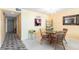 Bright dining area with a glass-top table and wicker chairs at 501 Spring Lakes Blvd # 501, Bradenton, FL 34210