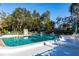 Community pool with lounge chairs and blue water at 501 Spring Lakes Blvd # 501, Bradenton, FL 34210