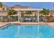 Refreshing community pool with pergola and seating at 5099 Flag St, Sarasota, FL 34232