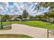 Fenced dog park with paved pathway and ample green space at 5099 Flag St, Sarasota, FL 34232