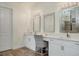 Elegant bathroom boasting double sinks, a vanity area, and chic light fixtures at 5116 Tivoli Run, Bradenton, FL 34211