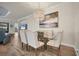 Formal dining room with a large, glass-top dining table and a statement chandelier at 5116 Tivoli Run, Bradenton, FL 34211