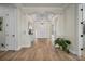 Spacious foyer featuring hardwood floors and an elegant chandelier at 5116 Tivoli Run, Bradenton, FL 34211