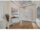 Bright and airy entryway with hardwood floors and a decorative console table at 5116 Tivoli Run, Bradenton, FL 34211